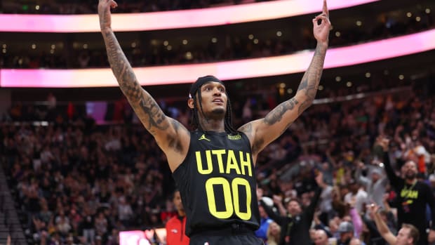 Utah Jazz guard Jordan Clarkson (00) reacts after making a three-point basket against the Houston Rockets in the third quarter at Vivint Arena.